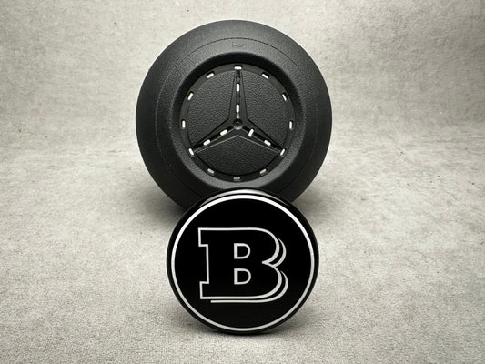 Brabus black emblem for airbag steering wheel, compatible with 2024+ Mercedes G-W465, S-W223, GLE, GLS models, sleek modern design