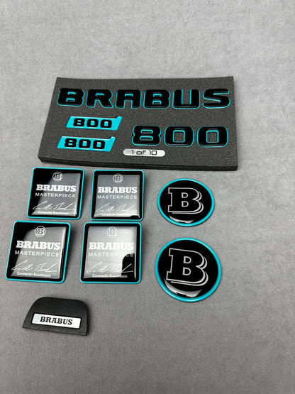 Brabus Blue 800 emblem badges set for Mercedes GT, including trunk, side, seat, steering wheel, and exclusive '1 of 10' aluminum emblem