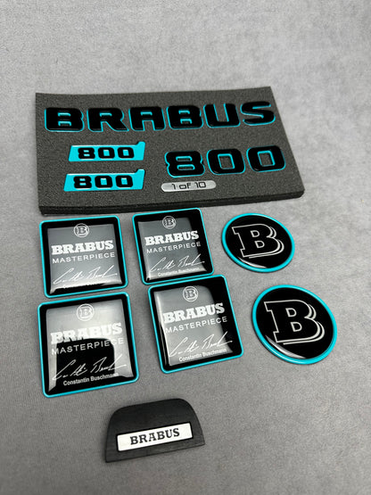 Brabus Blue 800 emblem badges set for Mercedes GT, including trunk, side, seat, steering wheel, and exclusive '1 of 10' aluminum emblem