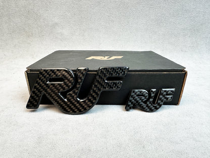 Bold solid carbon RUF badge for Porsche 930