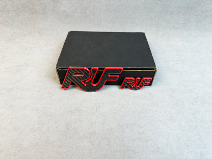 High-performance carbon RUF badges with red metal accents