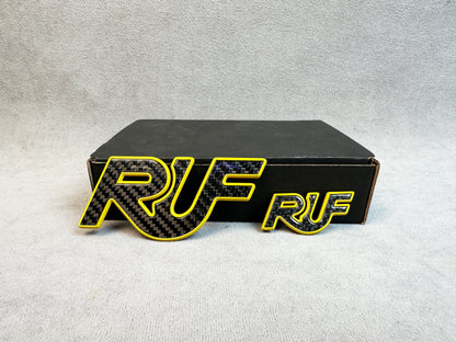 Rear trunk view of RUF yellow emblem on Porsche 993