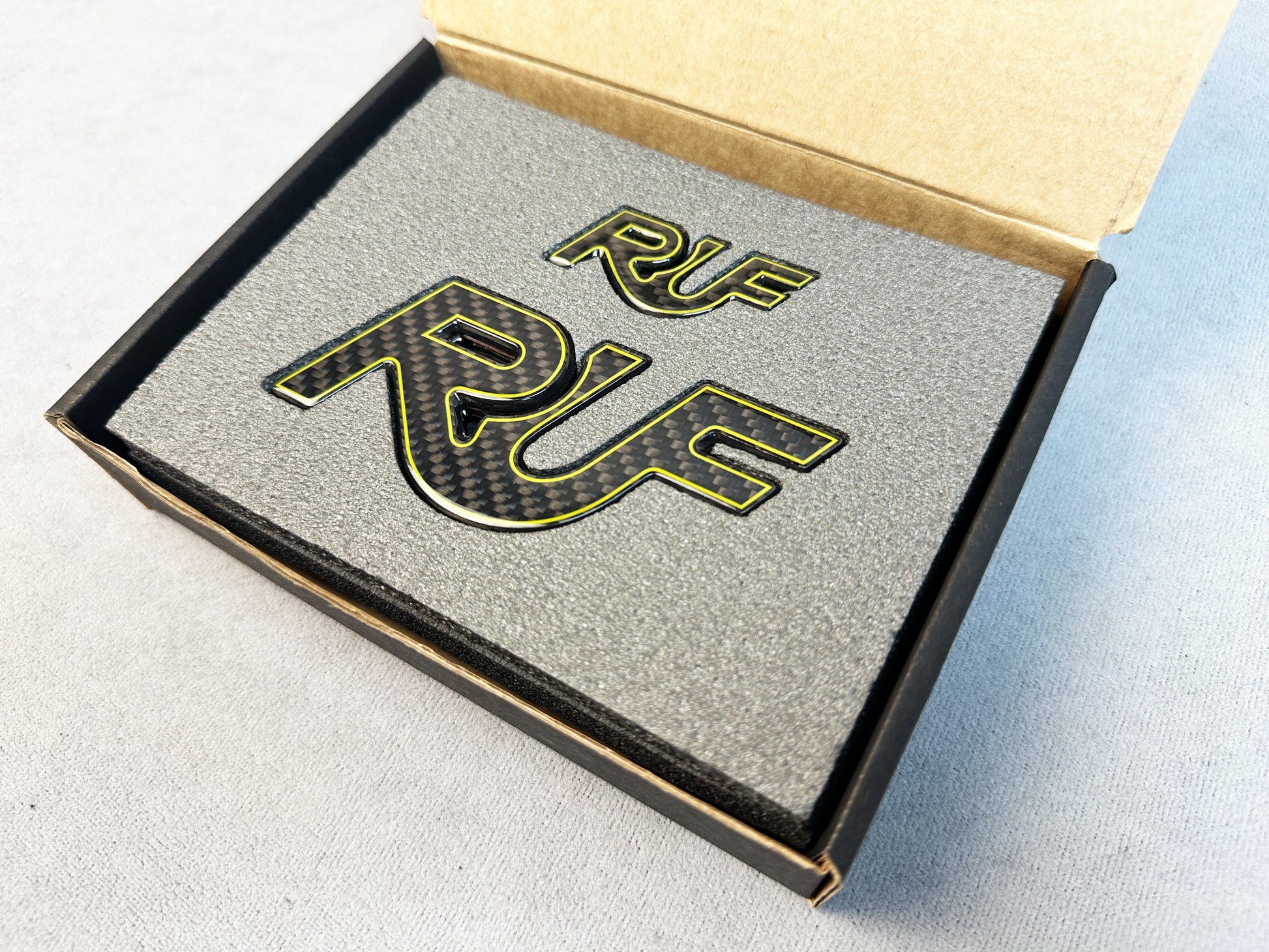 RUF yellow outline badge installed on Porsche 996 trunk