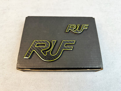 Twin badge set of RUF yellow outline emblems displayed