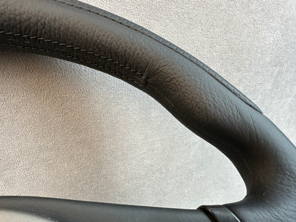 Factory airbag with leather covering on Evo steering wheel