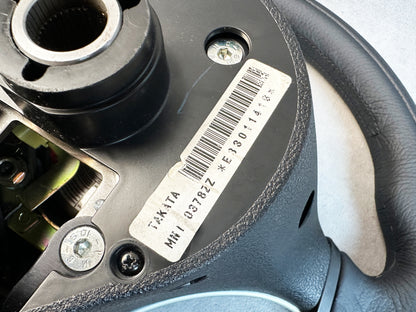 Mitsubishi logo airbag center on Evo 8 steering wheel