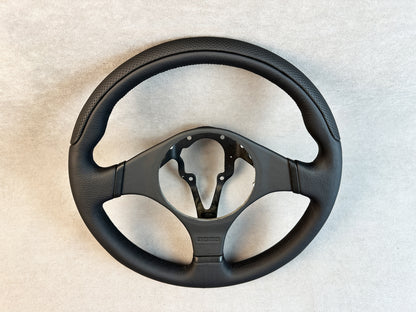 Close-up of fine leather stitching on MOMO Evo wheel