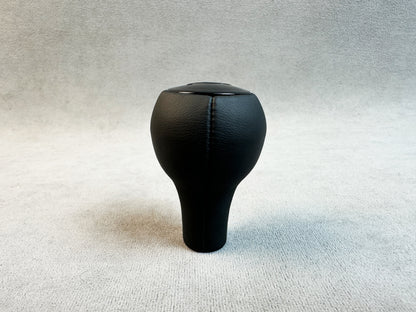 Glossy RUF plastic logo on leather shift knob