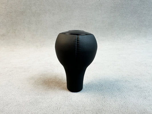 Glossy RUF plastic logo on leather shift knob