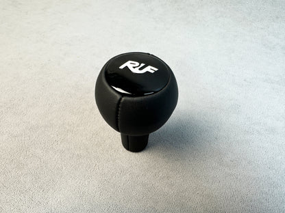 Close-up of RUF gloss plastic logo on leather knob