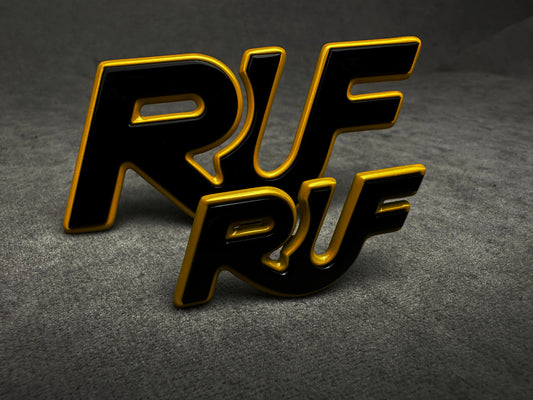 Close-up of yellow with black RUF badge for Porsche classic models